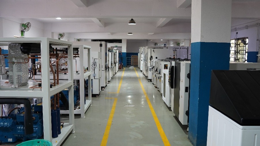 A view down the main aisle of the Envisys Factory showing the Test chambers partially built and being assembled during the manufacturing process.